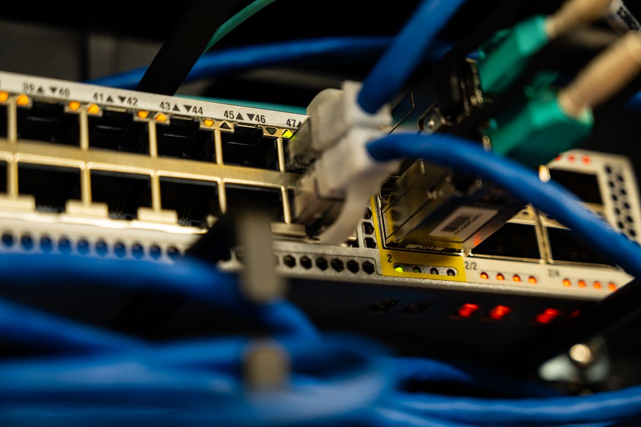 Crafting Captivating Headlines: Your awesome post title goes here Close-up image of ethernet cables plugged into a network switch, showcasing IT infrastructure.